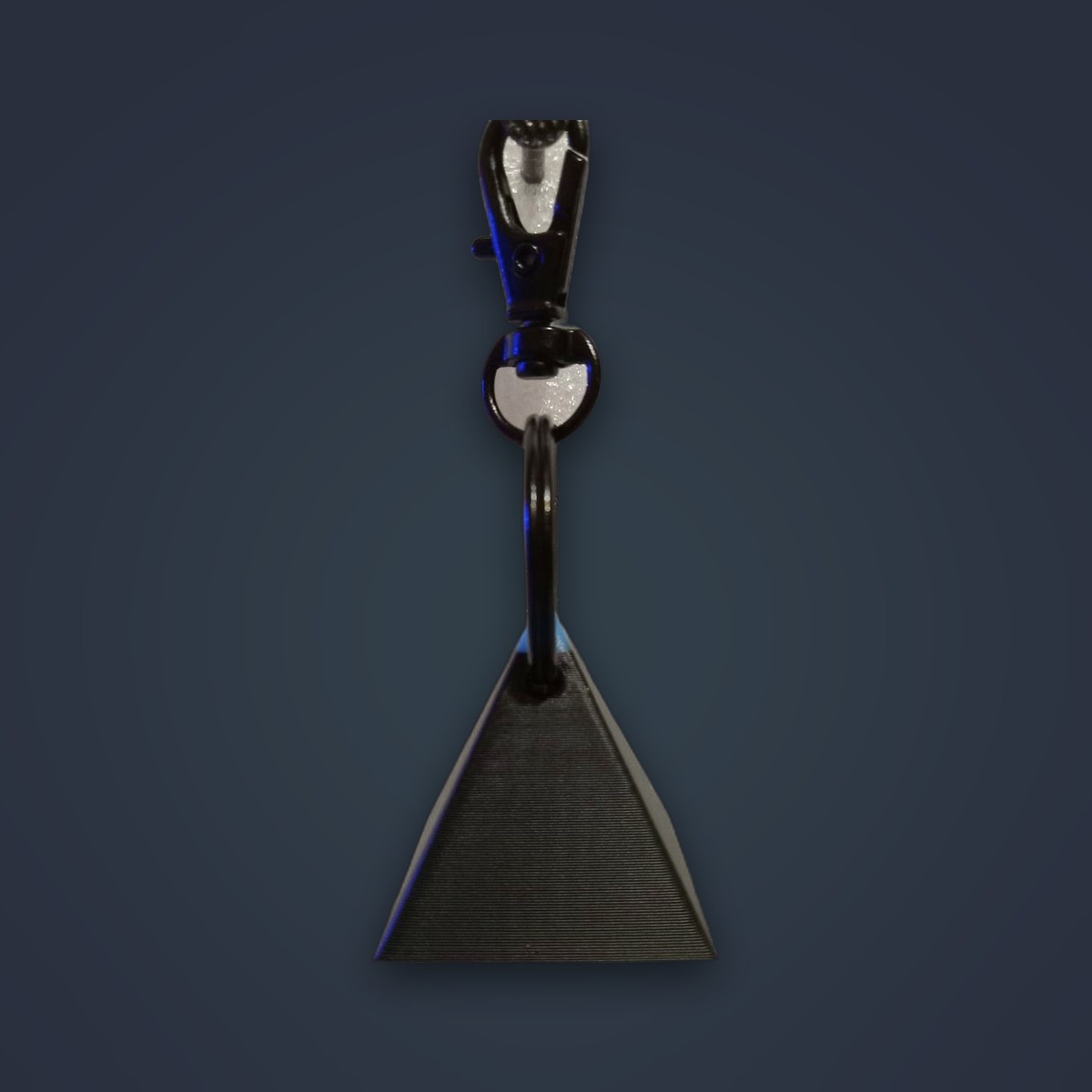 Comets keychain, Black colorway, angle 1 of 2
