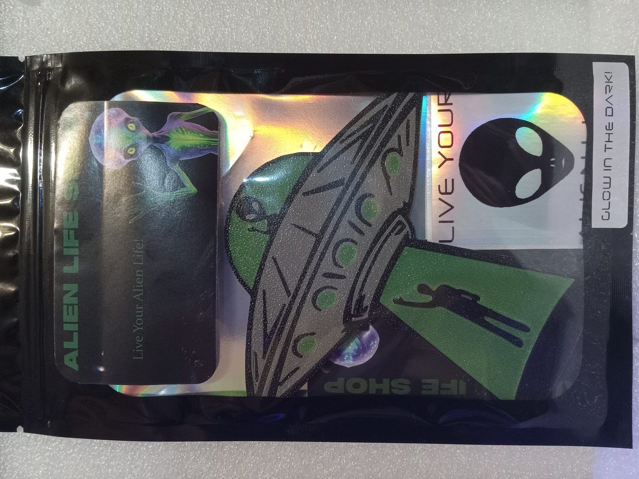 Glow Ships keychain, The Saucer colorway, angle 3 of 5